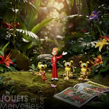 Tubo SPIROU et MARSUPILAMI : 7 figurines Plastoy en petit musée floral, près d’un magazine de BD ouvert.