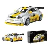 Voiture de collection Opel Astra V8 coupé en briques, livrée blanche et jaune avec aileron, pièces CADA 305 et boîte du set.