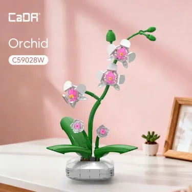 Orchidée CADA 237 pièces: plante florale anti-stress en briques, tige verte, fleurs orchidées blanches et roses, base ronde blanche sur bureau pastel.