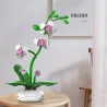 Orchidée CADA 237 pièces : ensemble de construction florale anti-stress, orchidée géante en pièces blanches et vertes sur pot circulaire blanc.
