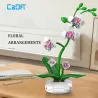Orchidée CADA 237 pièces – ensemble floral anti-stress: plante artificielle verte avec fleurs roses modulables sur tiges, base blanche.