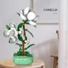 Arbre floral en pièces Camellia CADA, plante avec fleurs blanches sur tronc brun, dans socle vert et base carrée en briques cada.