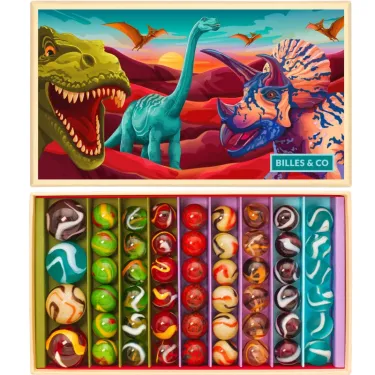 Grand coffret de billes "Dinosaures" Billes & Co: boîte décorée de dinosaures avec rangées multicolores de billes à l’intérieur du coffret.