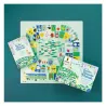 Jeu de l’oie coloré intitulé Dans le jardin de Claude Monet, avec le plateau de jeu rond, cartes et livret illustré sur fond vert.