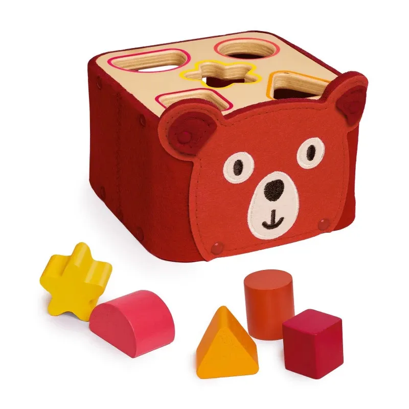 Boîte à formes DJECO 6492 SoftiShape rouge avec face d’ours, ouvertures sur le couvercle pour insérer des pièces géométriques colorées (étoile, demi-cercle, triangle, cube, cylindre).