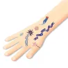 Tatouages phosphorescents « Sweet dreams » DJECO 9592 sur le poignet: motifs marins et étoiles colorés, écriture bleue lumineuse