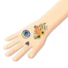 Tatouages phosphorescents Reflets de nuit DJECO 9618 : motifs d’un renard, fleurs et insectes sur le poignet, style tatouage temporaire.