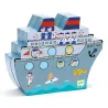 Naviplouf jeu de bataille navale magnétique DJECO 5270: bateau magnétique coloré avec voyageurs et marins dessinés, décor océan et drapeaux.