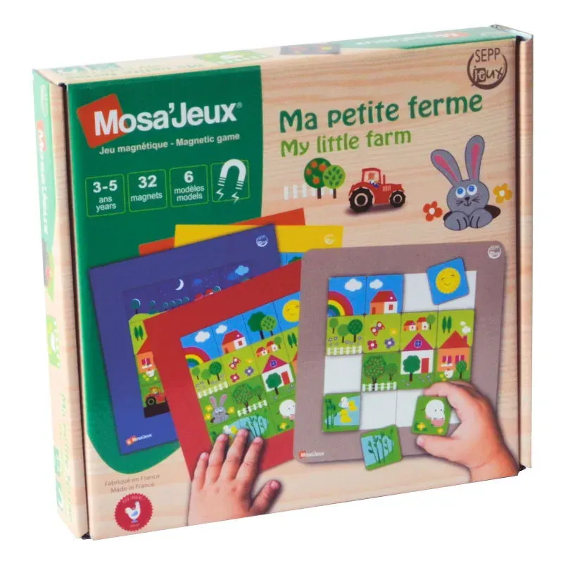 Boîte du jeu magnétique Mosa’Jeux « Ma petite ferme / My little farm » avec pièces et maisons colorées, main manipulant les éléments.