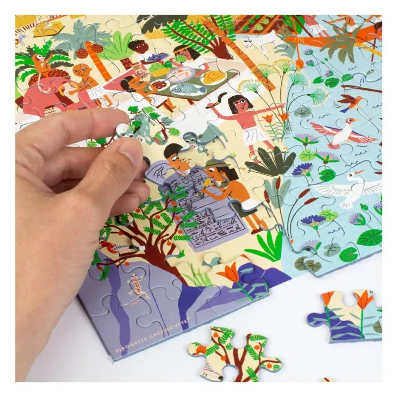 Puzzle en cours d’assemblage avec des personnages et paysages colorés, pièces à placer sur le territoire jungle.